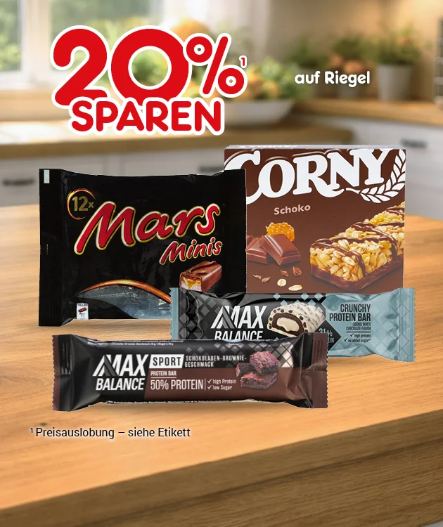 Diese Grafik zeigt auf Wohnraumhintergrund mit Holztisch die Aussage &bdquo;Zwanzig Prozent sparen auf Riegel&ldquo;. Abgebildet sind Mars Minis, Corny Schoko sowie zwei Max-Balance-Riegel, darunter ein Sport-Riegel mit f&uuml;nfzig Prozent Protein und ein Crunchy-Peanut-Bar-Riegel. Der Hinweis lautet: &bdquo;Preisauslobung &ndash; siehe Etikett.&ldquo; Unten l&auml;dt ein Button &bdquo;Weitere Sparangebote entdecken&ldquo; zum Klicken ein.