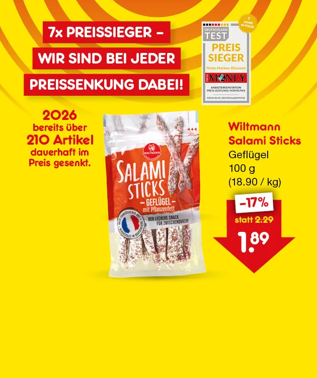 Auf der Werbegrafik mit leuchtend gelbem Hintergrund und roten Aktionsfl&auml;chen steht die Headline &bdquo;7x Preissieger &ndash; Wir sind bei jeder Preissenkung dabei!&ldquo;. Links ist das Siegel &bdquo;Deutschland Test Preissieger&ldquo; abgebildet, erg&auml;nzt durch den Hinweis, dass 2026 bereits &uuml;ber 210 Artikel dauerhaft im Preis gesenkt wurden. Rechts ist eine Packung Wiltmann Salami Sticks Gefl&uuml;gel (100 g) zu sehen. Daneben wird die Preisreduzierung von 17 % hervorgehoben, mit einem Angebotspreis von 1,89 &euro; statt 2,29 &euro; (18,90 &euro;/kg).